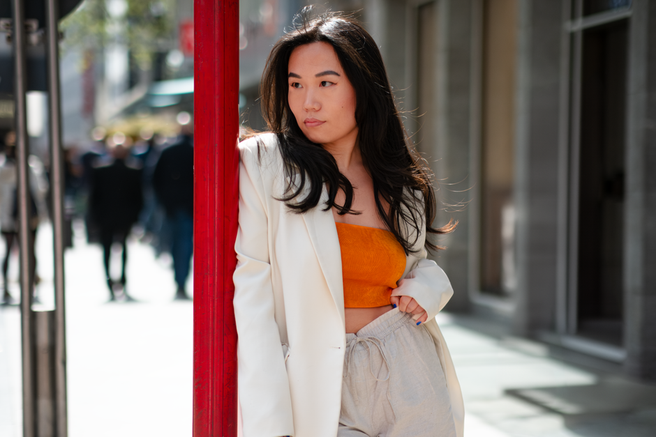 Stylish woman poses in urban Cologne, Germany street scene.
